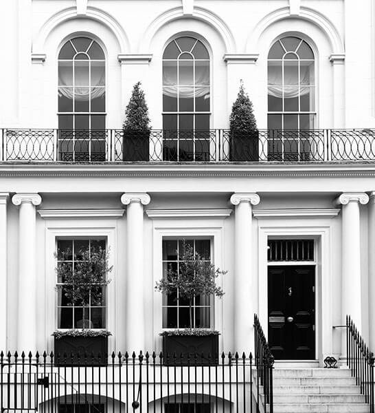 White facade of expensive apartment house in Kensington London