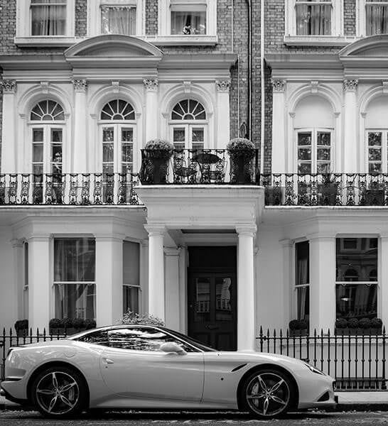 A sports car outside a Super Prime property in South Kensington which retains a property management service to look after it.