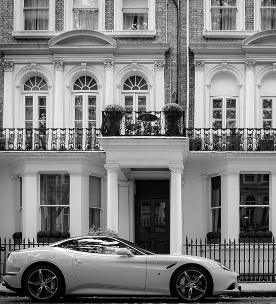 a sports car in front of London apartments