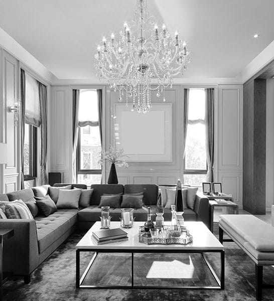 luxury living room with a chandelier as a center piece